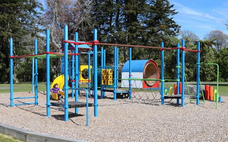 Kid sliding down slide at Victoria Park Playground