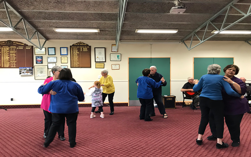 Photo of members of positive ageing group dancing 