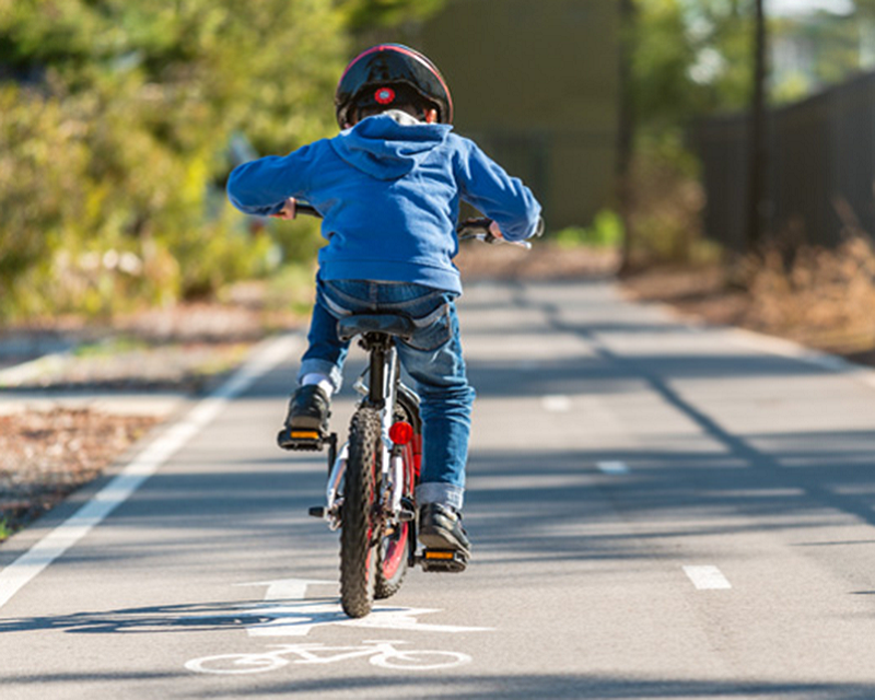 Photo of a young boy on a bike
